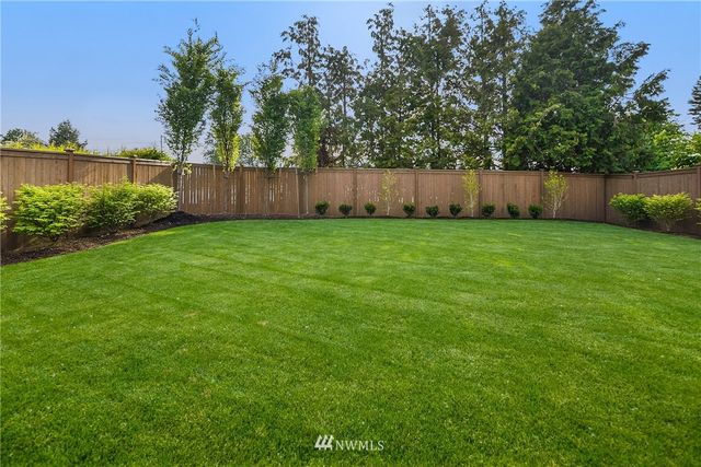 a view of a lake with a building in the background
