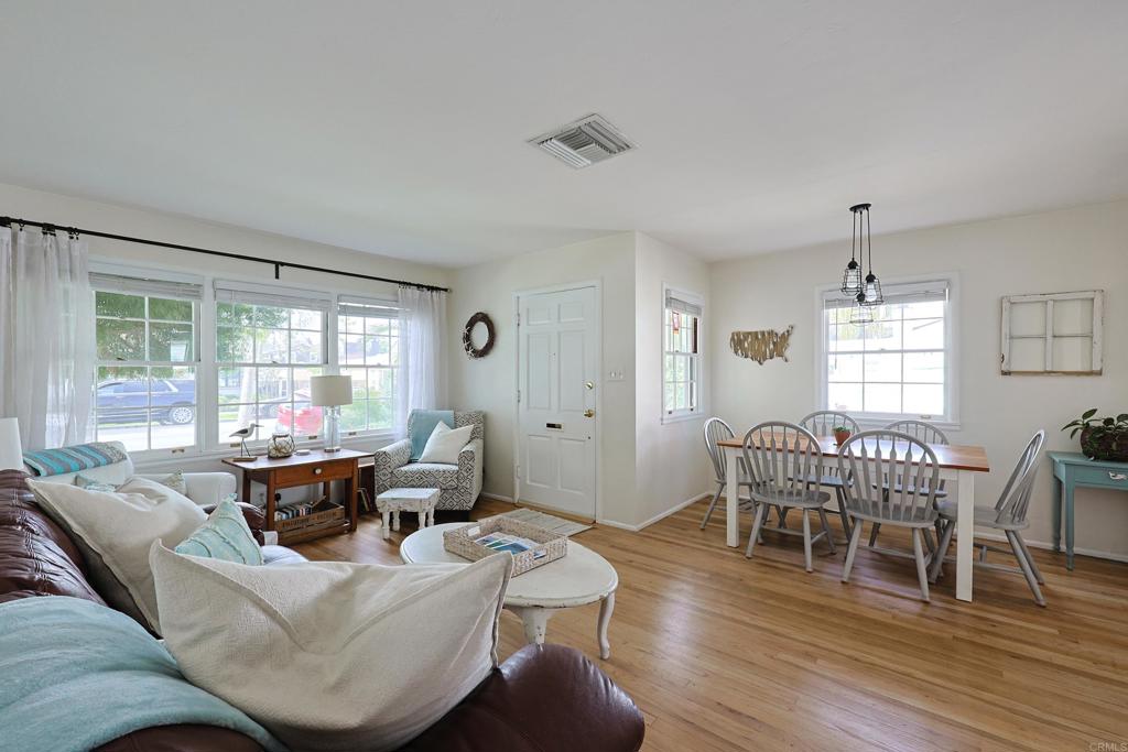 417 5th Street Coronado, CA 92118 - Photo 15 of 46 a living room with furniture wooden floor and a window