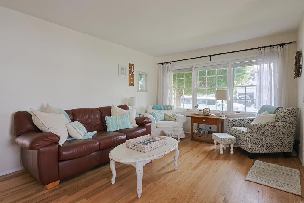 417 5th Street Coronado, CA 92118 - Photo 4 of 46 a living room with furniture and a large window