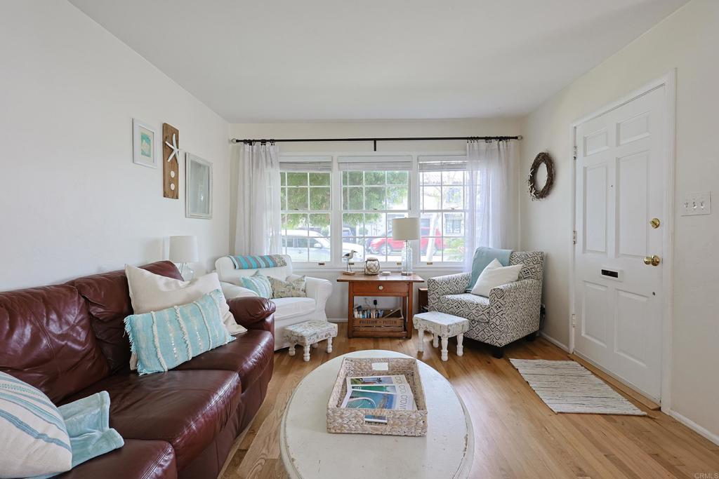 417 5th Street Coronado, CA 92118 - Photo 5 of 46 a living room with furniture and a large window