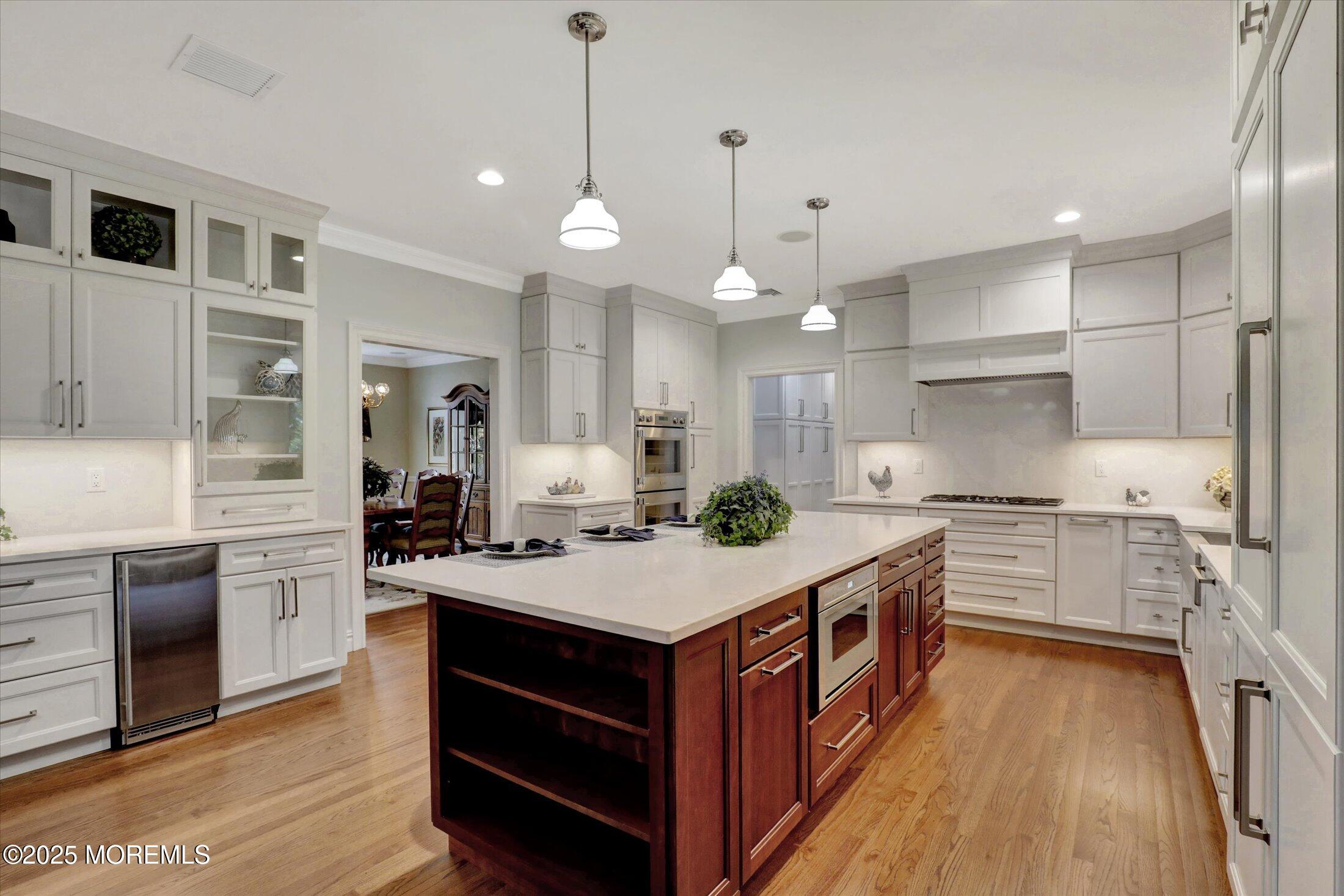 10 Yellow Brook Road Holmdel, NJ 07733 - Photo 12 of 64 a large kitchen with stainless steel appliances granite countertop a stove oven and a refrigerator