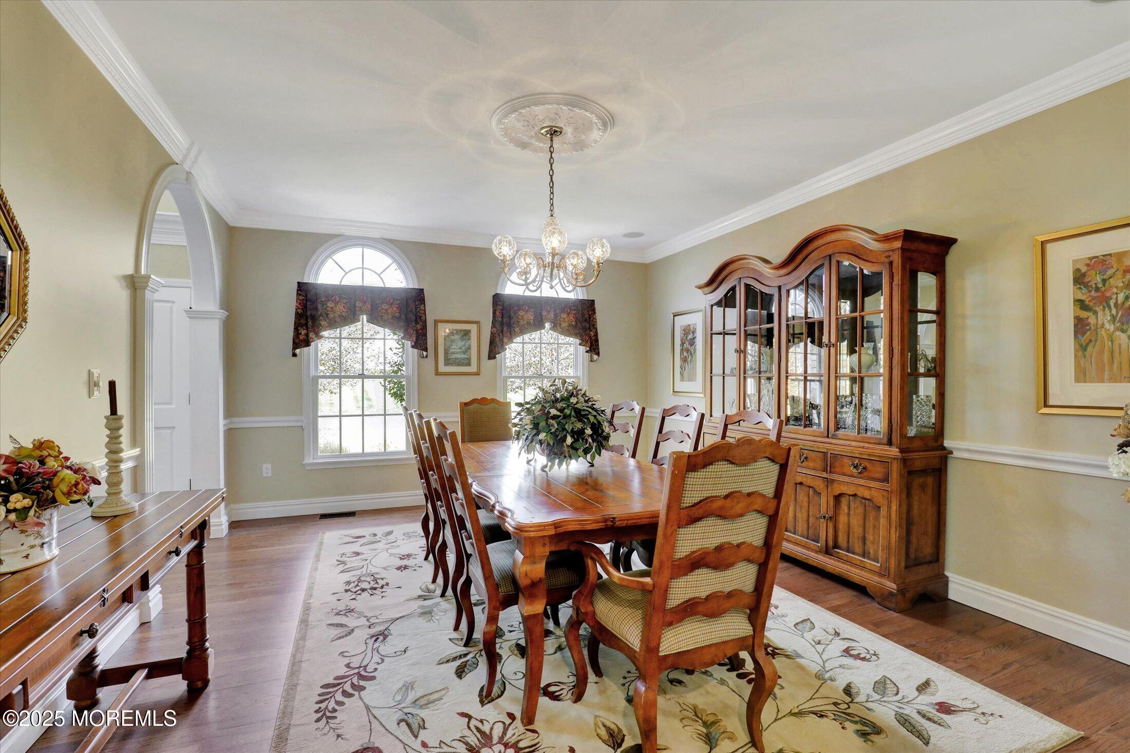 10 Yellow Brook Road Holmdel, NJ 07733 - Photo 20 of 64 a view of a dining room with furniture and chandelier