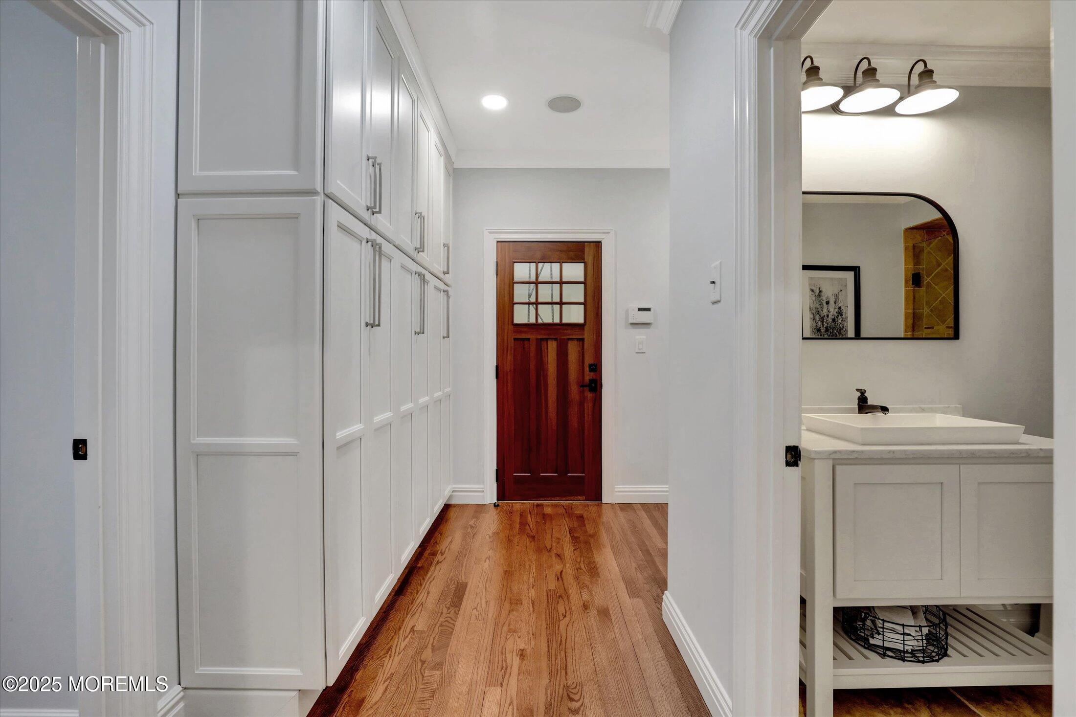 10 Yellow Brook Road Holmdel, NJ 07733 - Photo 25 of 64 a view of a hallway with wooden floor and staircase