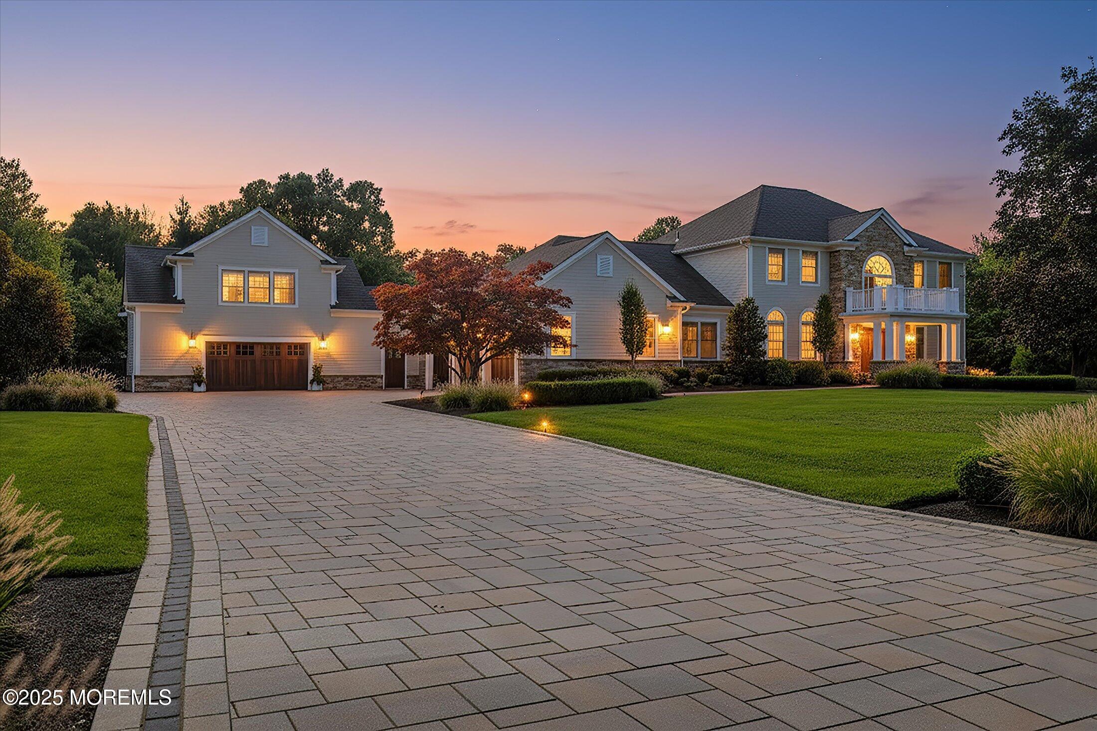 10 Yellow Brook Road Holmdel, NJ 07733 - Photo 3 of 64 a front view of a house with a yard and garage