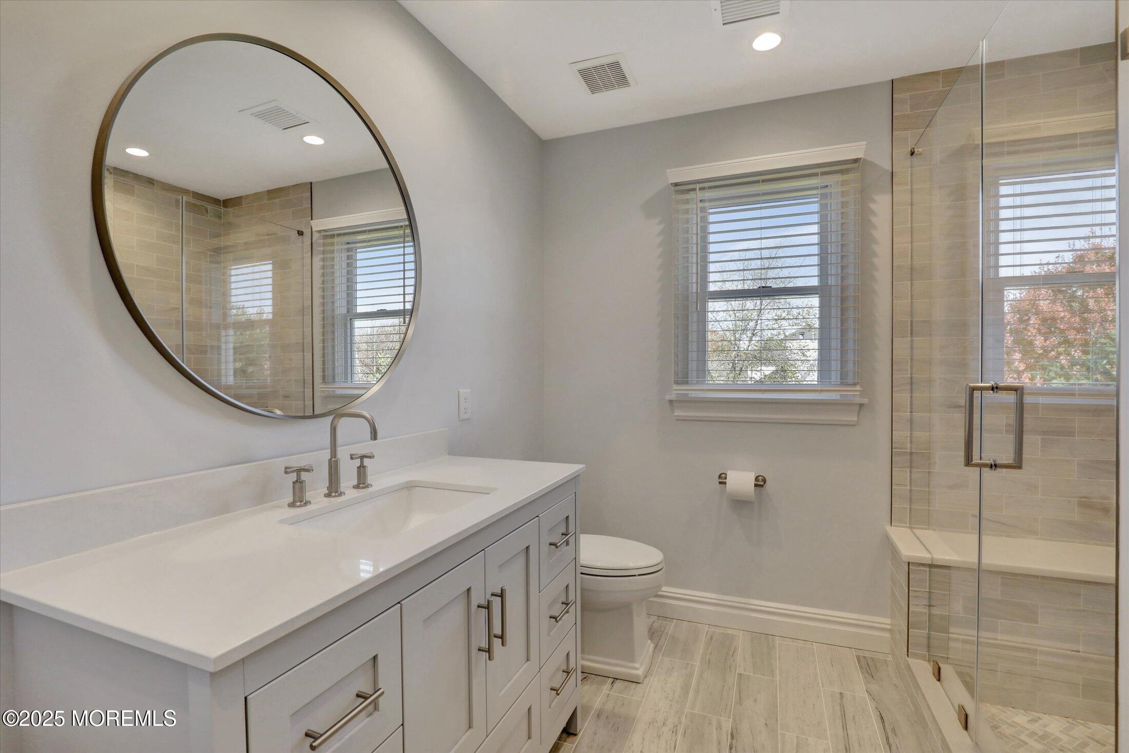 10 Yellow Brook Road Holmdel, NJ 07733 - Photo 35 of 64 a bathroom with a sink and a mirror
