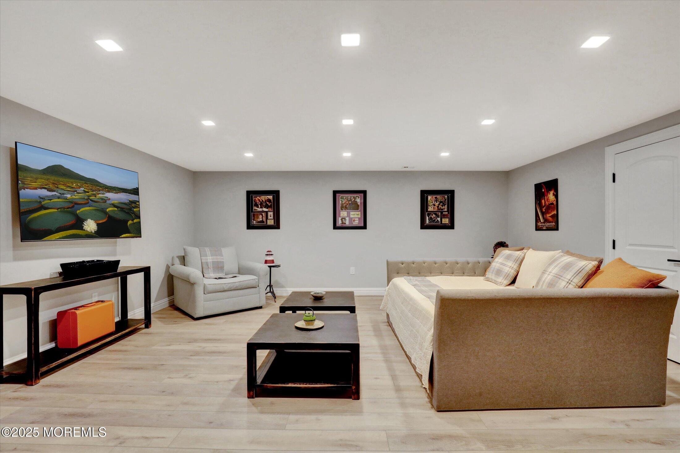 10 Yellow Brook Road Holmdel, NJ 07733 - Photo 38 of 64 a living room with furniture and a flat screen tv