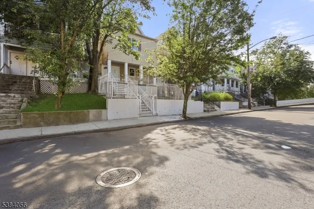 a view of a house with a yard and garage