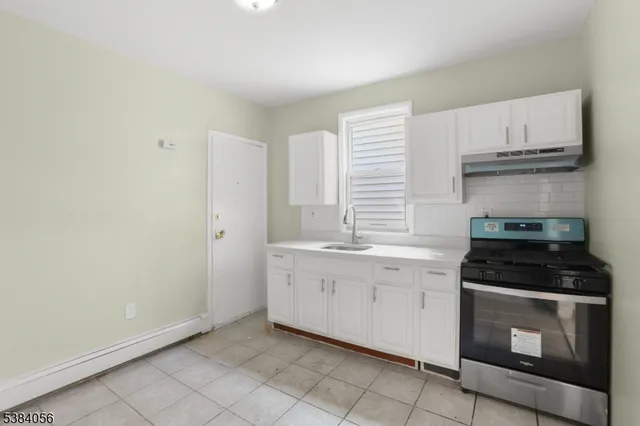 a view of staircase with white walls