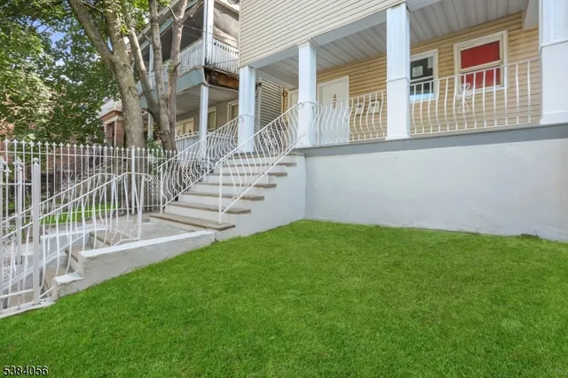 front view of a house with a yard