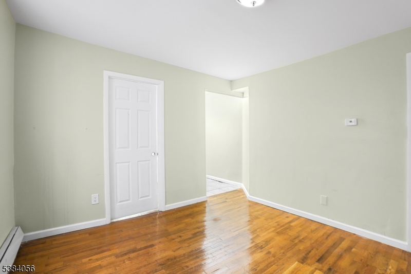 406 South 15th Street Newark, NJ 07103 - Photo 10 of 32 a view of empty room with wooden floor