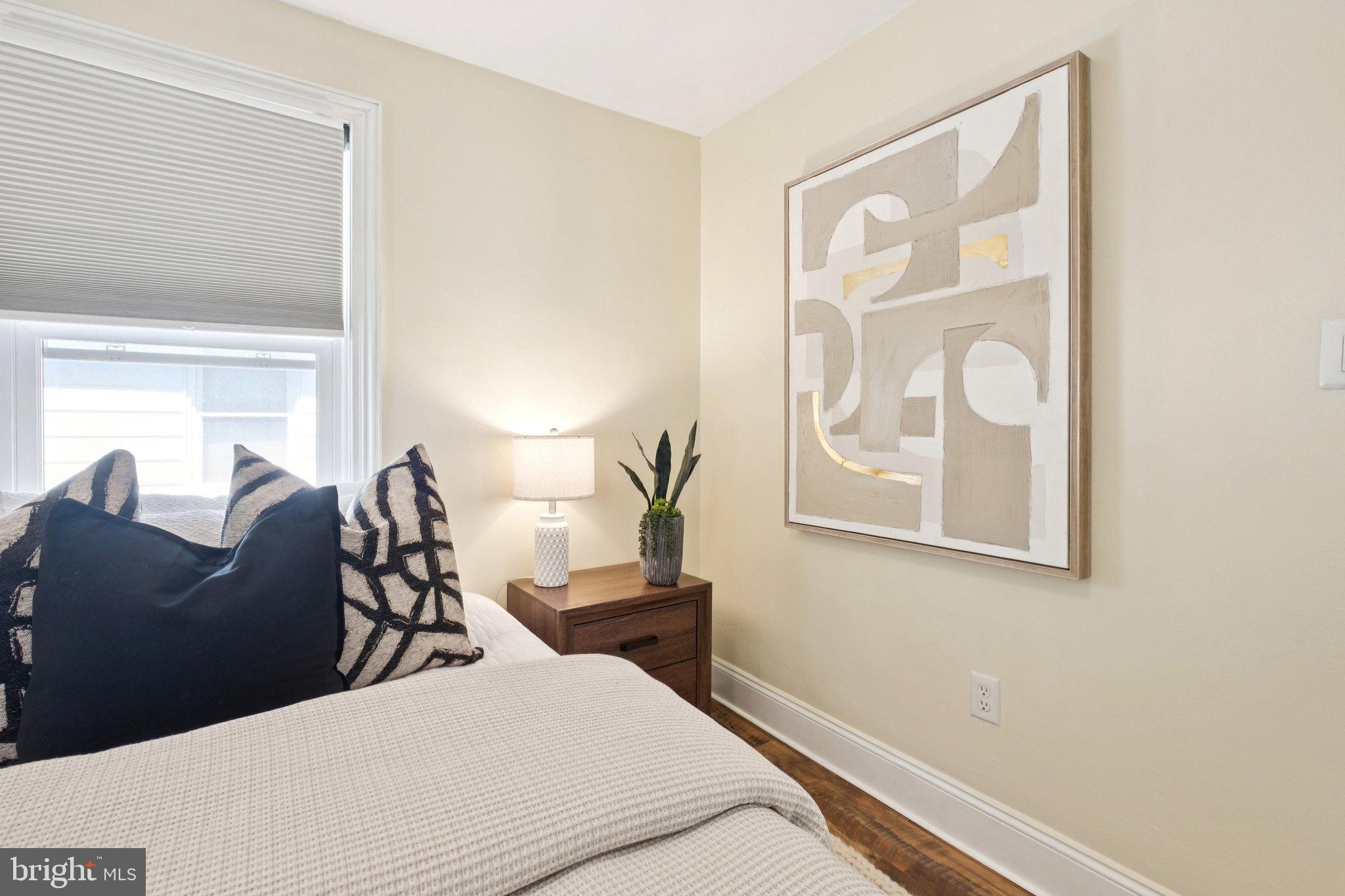 20 West Forestview Road Brookhaven, PA 19015 - Photo 19 of 34 a bedroom with a bed and wooden floor