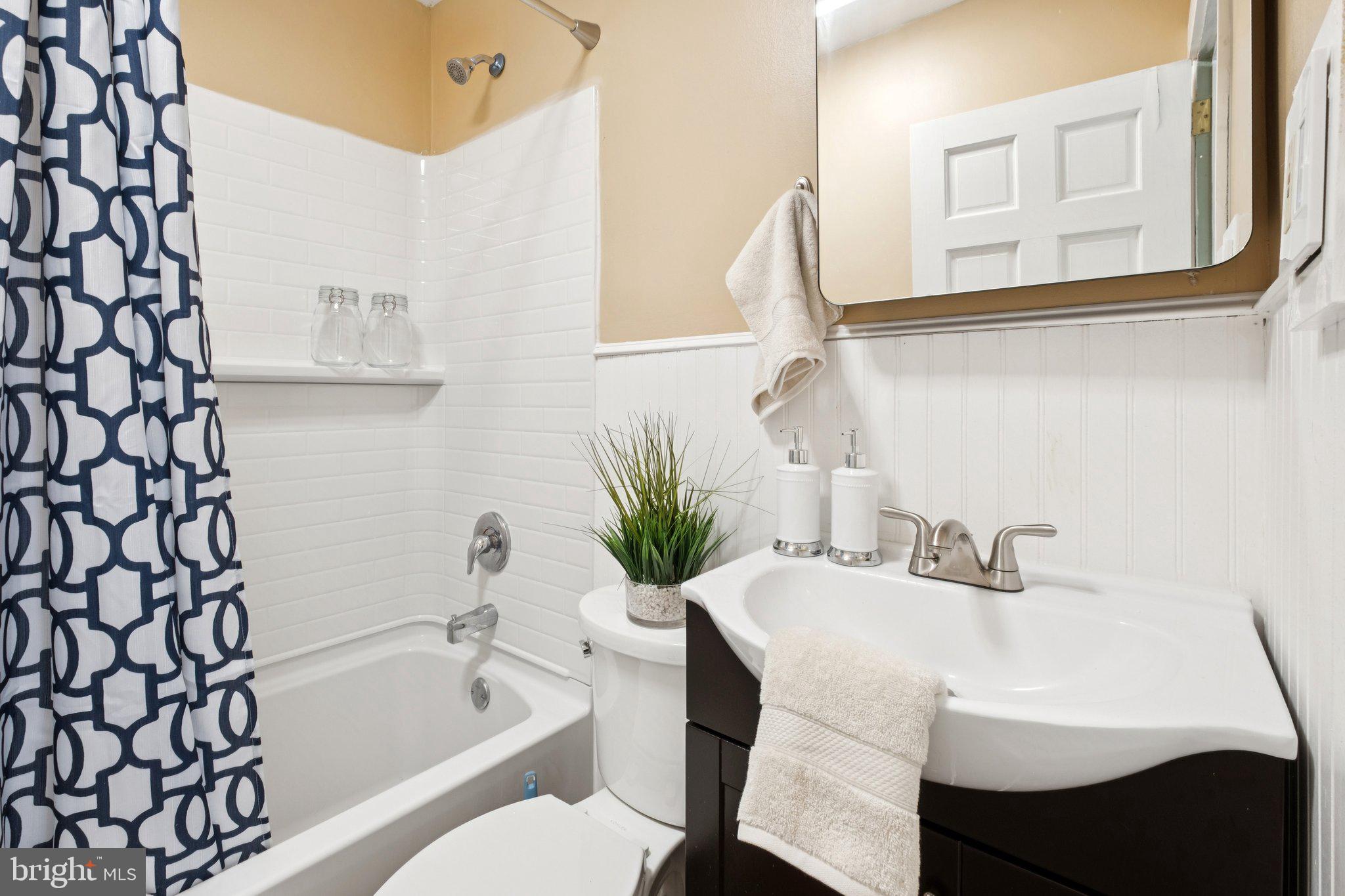 20 West Forestview Road Brookhaven, PA 19015 - Photo 20 of 34 a bathroom with a sink toilet and bathtub