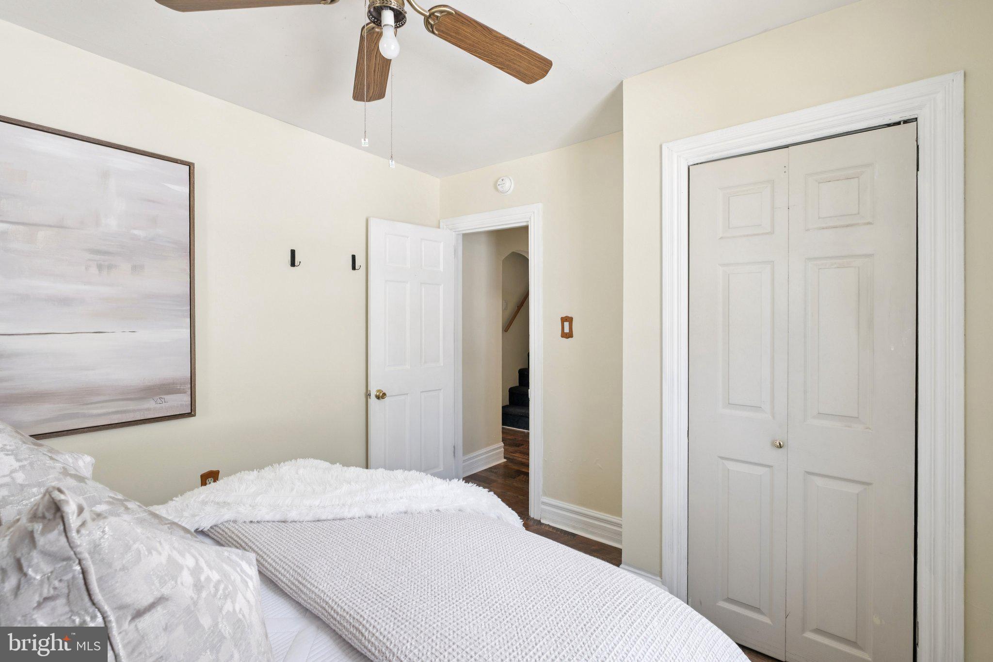 20 West Forestview Road Brookhaven, PA 19015 - Photo 22 of 34 a bedroom with a white bed and wooden floor