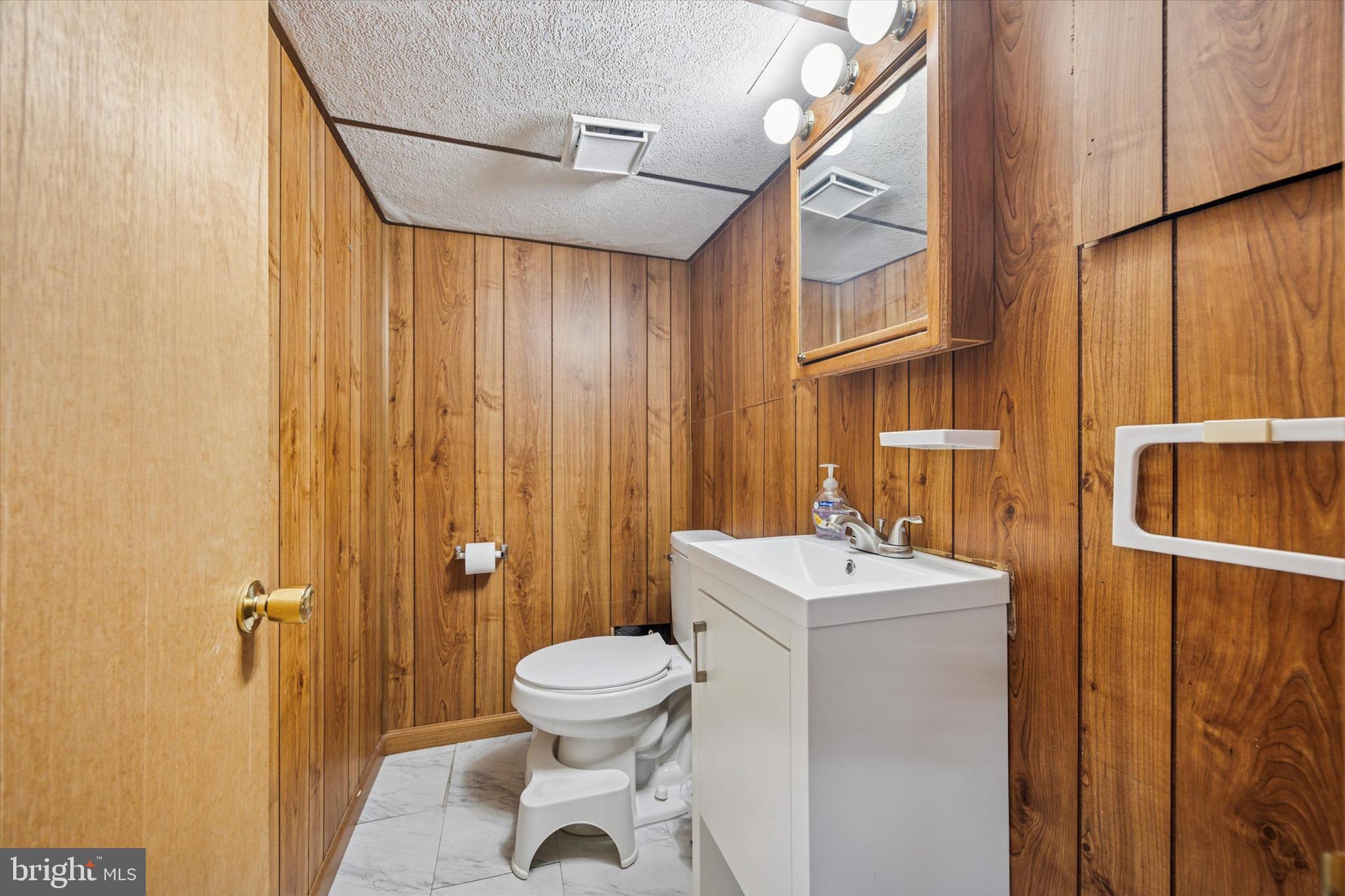 20 West Forestview Road Brookhaven, PA 19015 - Photo 26 of 34 a bathroom with a sink mirror toilet and shower