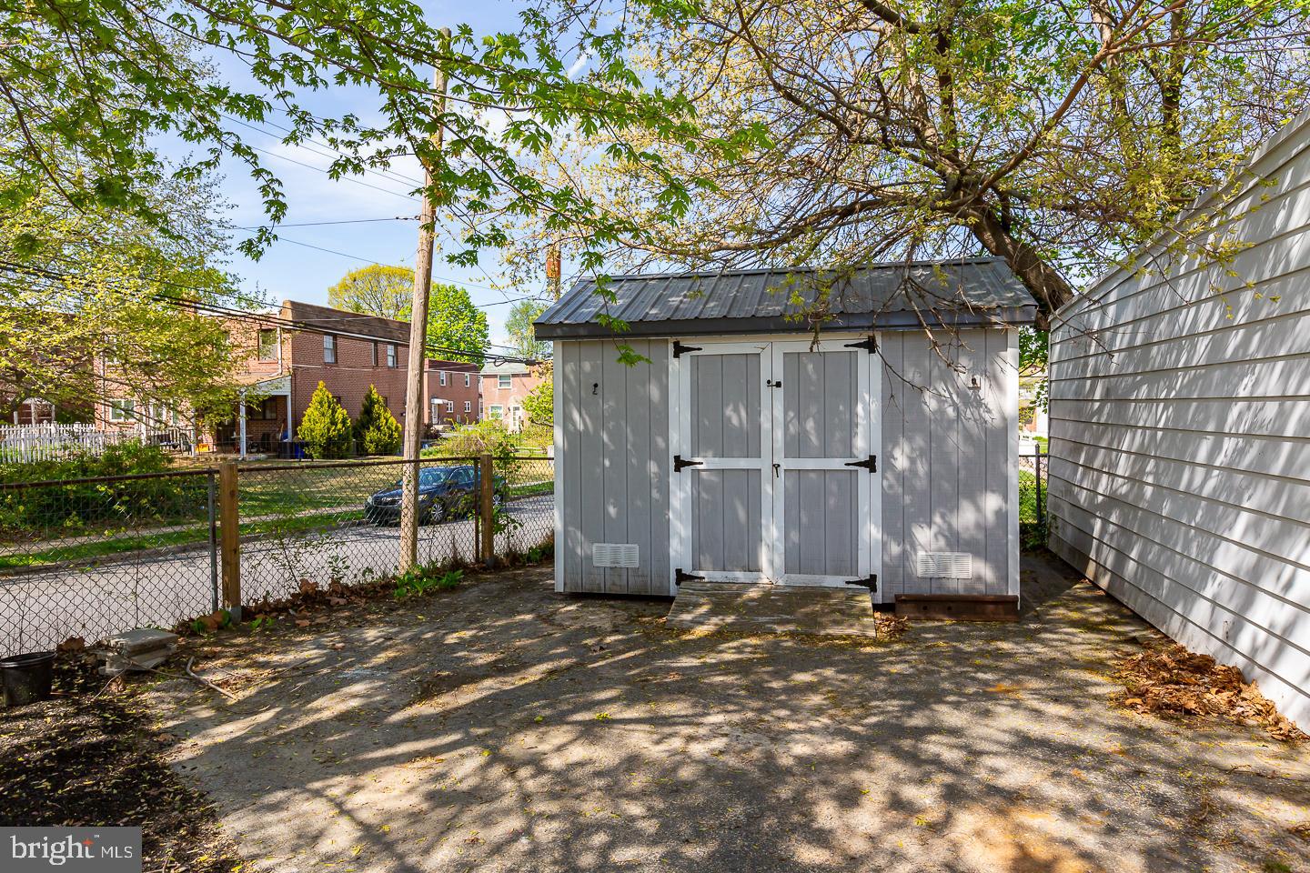 20 West Forestview Road Brookhaven, PA 19015 - Photo 32 of 34 a view of a barn house next to a yard with wooden fence