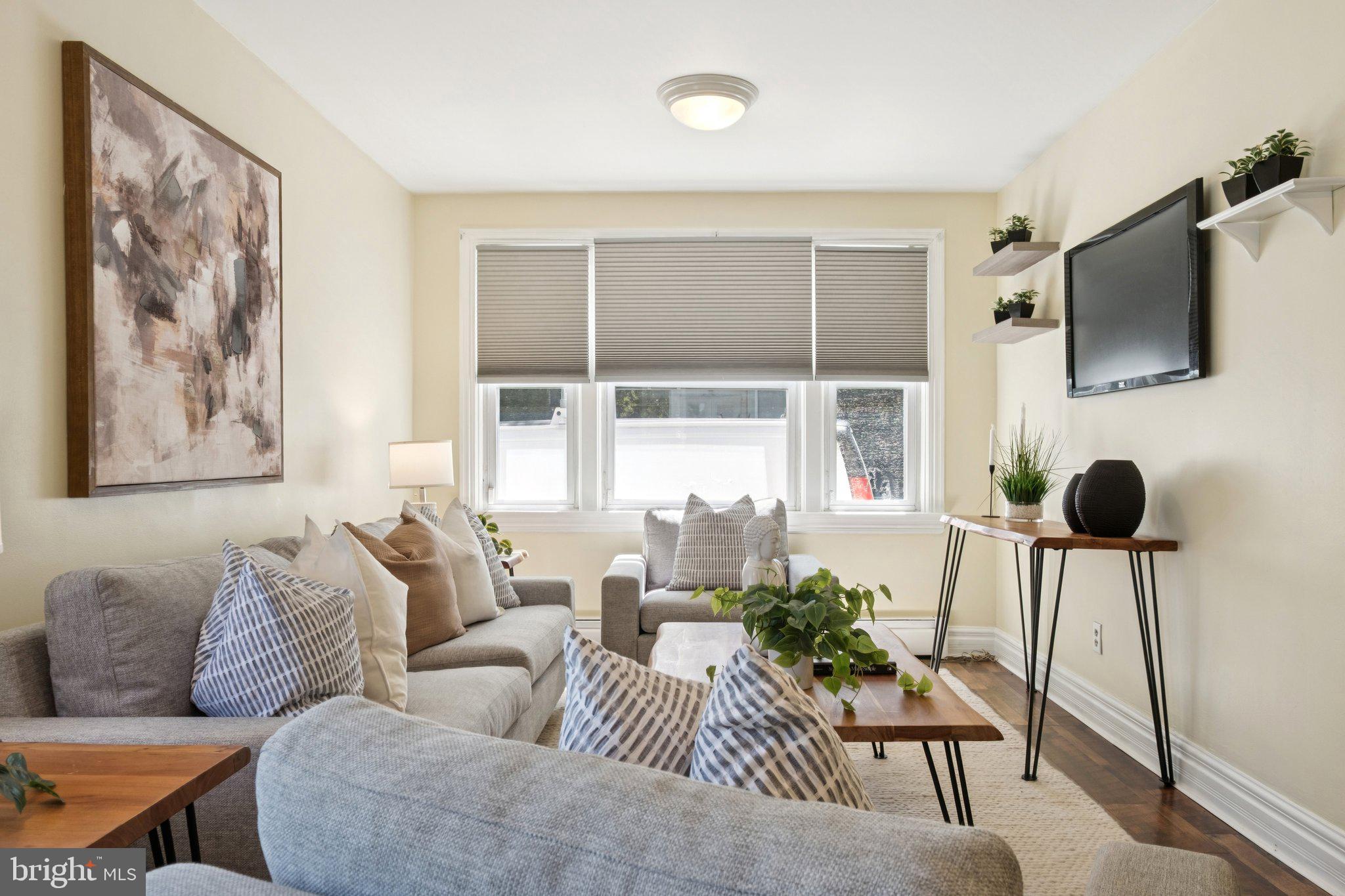 20 West Forestview Road Brookhaven, PA 19015 - Photo 4 of 34 a living room with furniture and a flat screen tv