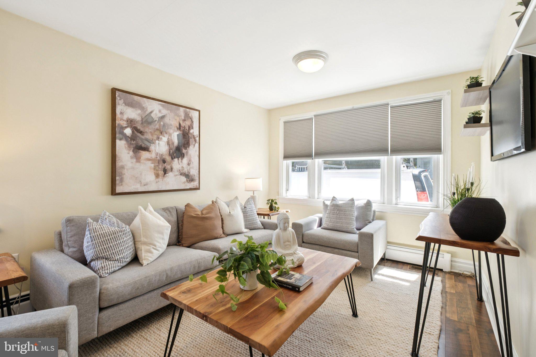 20 West Forestview Road Brookhaven, PA 19015 - Photo 7 of 34 a living room with furniture and a large window