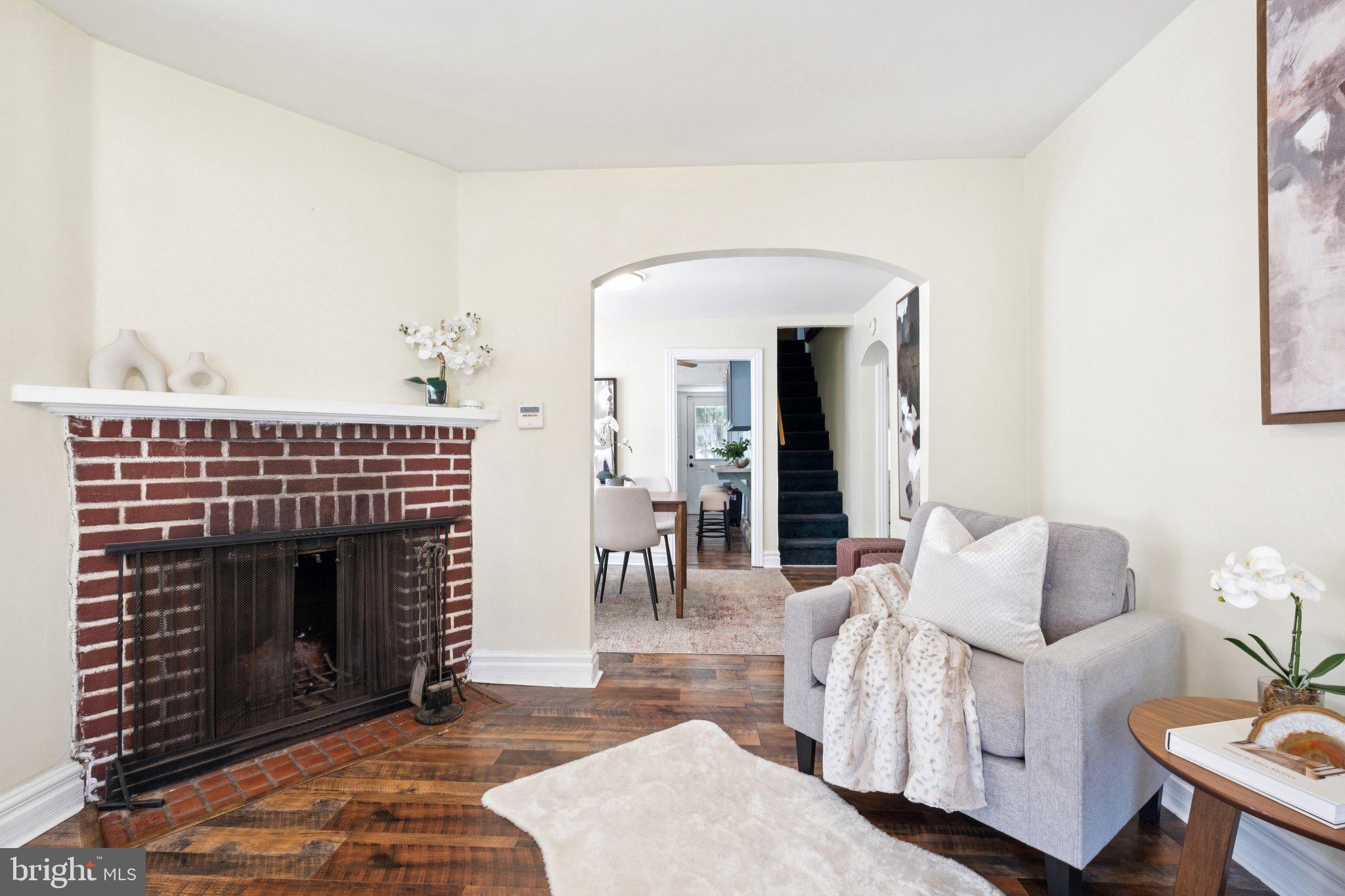 20 West Forestview Road Brookhaven, PA 19015 - Photo 8 of 34 a living room with furniture a fireplace and a dining table