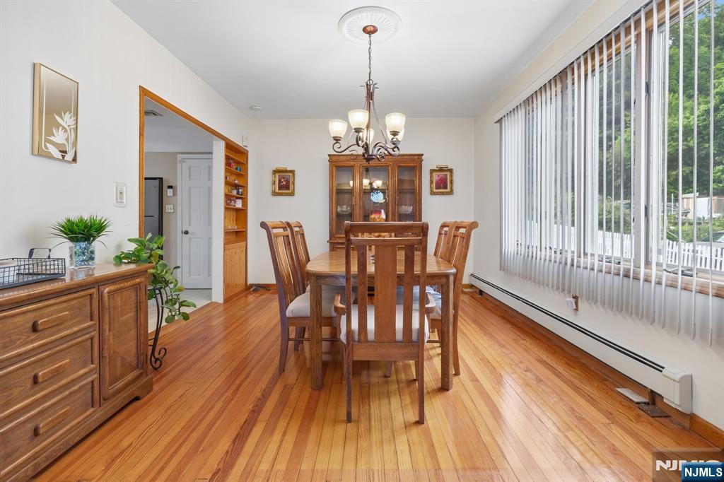 562 Valley Road Clifton, NJ 07013 - Photo 11 of 35 a view of a dining room with furniture window and wooden floor