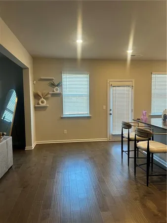 a view of a livingroom with furniture and wooden floor