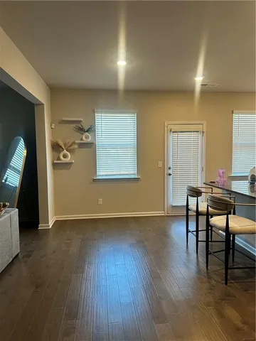 a view of a livingroom with furniture and wooden floor