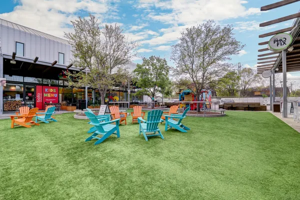 a childrens park with lots of swings and slides
