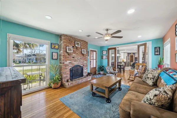 a living room with furniture and a fireplace