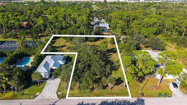 an aerial view of house with yard