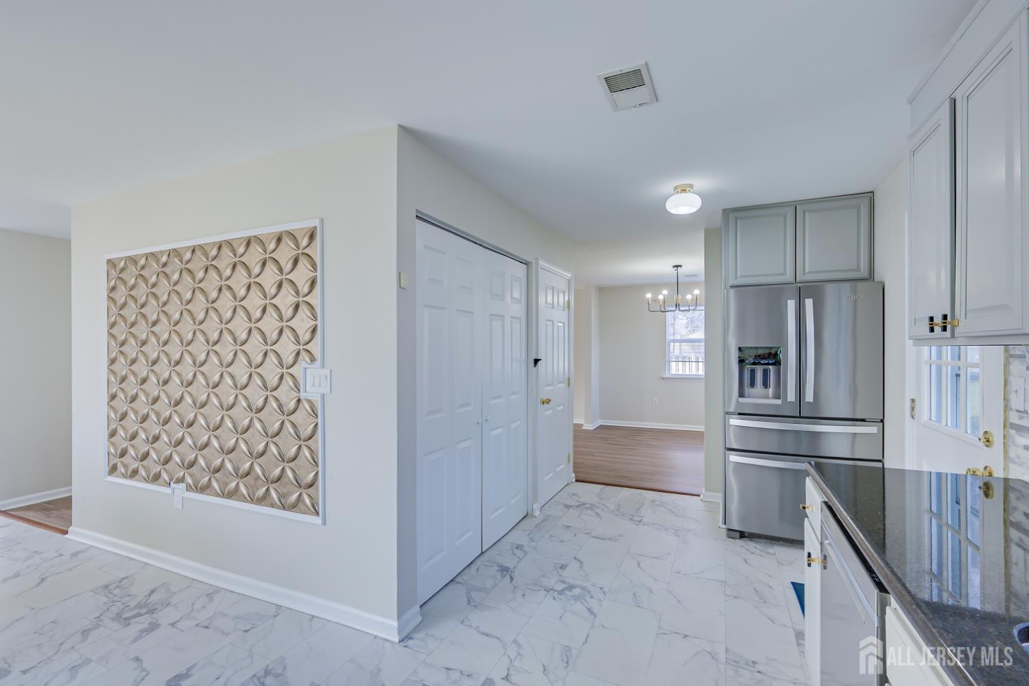 17 Idlewild Road Edison, NJ 08817 - Photo 18 of 36 a kitchen with stainless steel appliances a refrigerator and cabinets