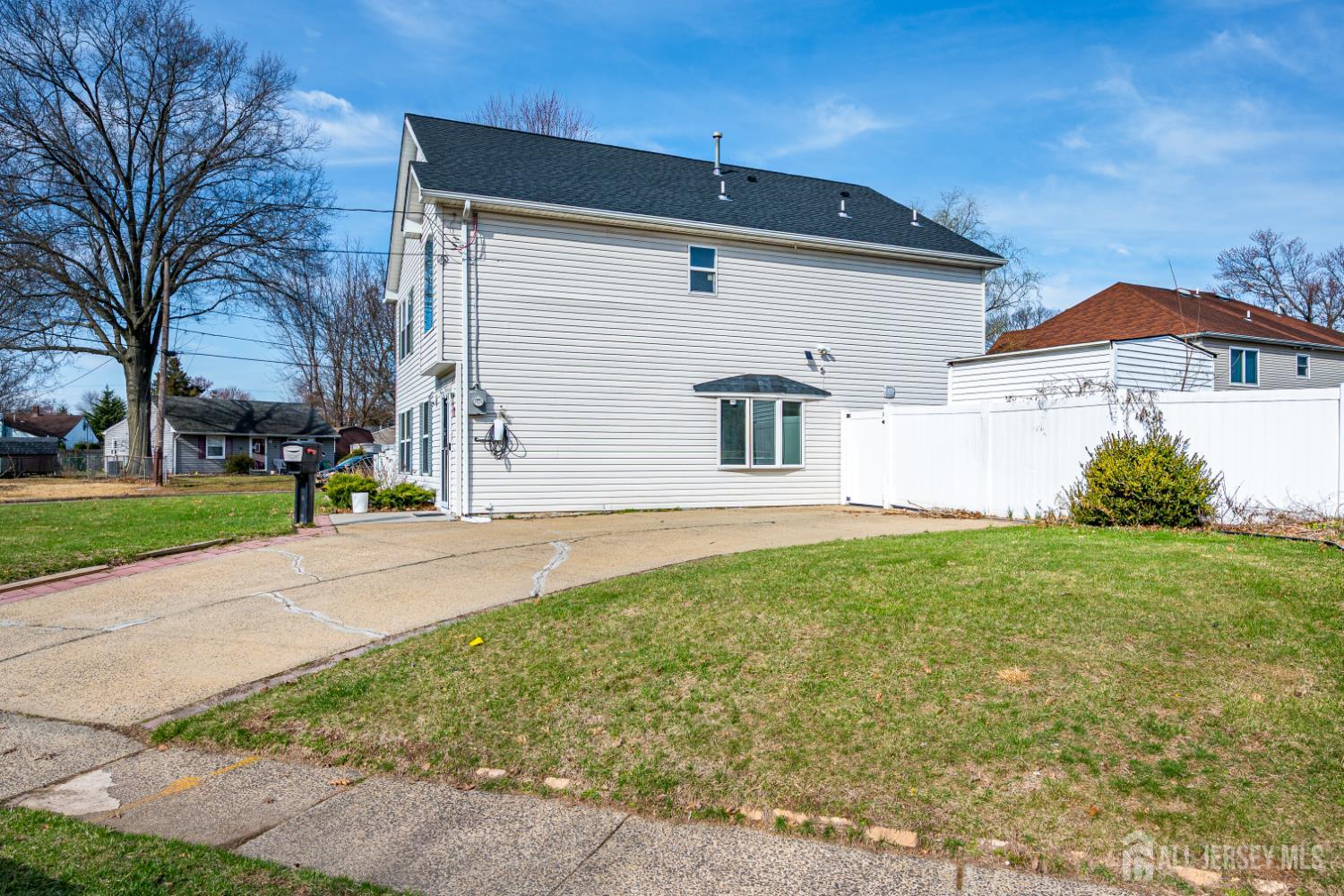 17 Idlewild Road Edison, NJ 08817 - Photo 3 of 36 a front view of a house with a yard