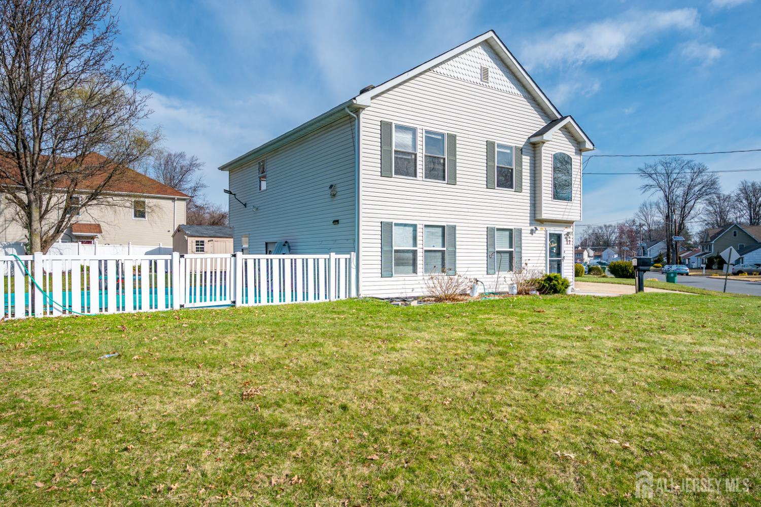 17 Idlewild Road Edison, NJ 08817 - Photo 4 of 36 a front view of a house with a yard