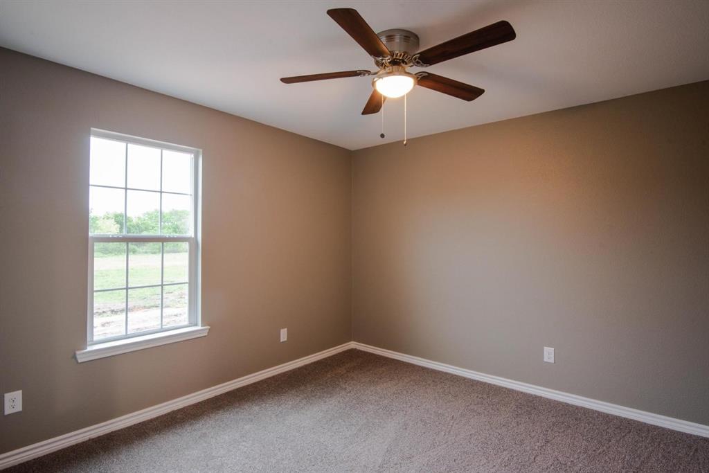 400 Allen Avenue Bonham, TX 75418 - Photo 12 of 14 an empty room with a window