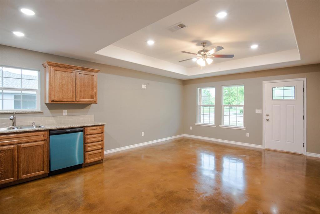 400 Allen Avenue Bonham, TX 75418 - Photo 9 of 14 a view of a kitchen with a sink cabinets and wooden floor