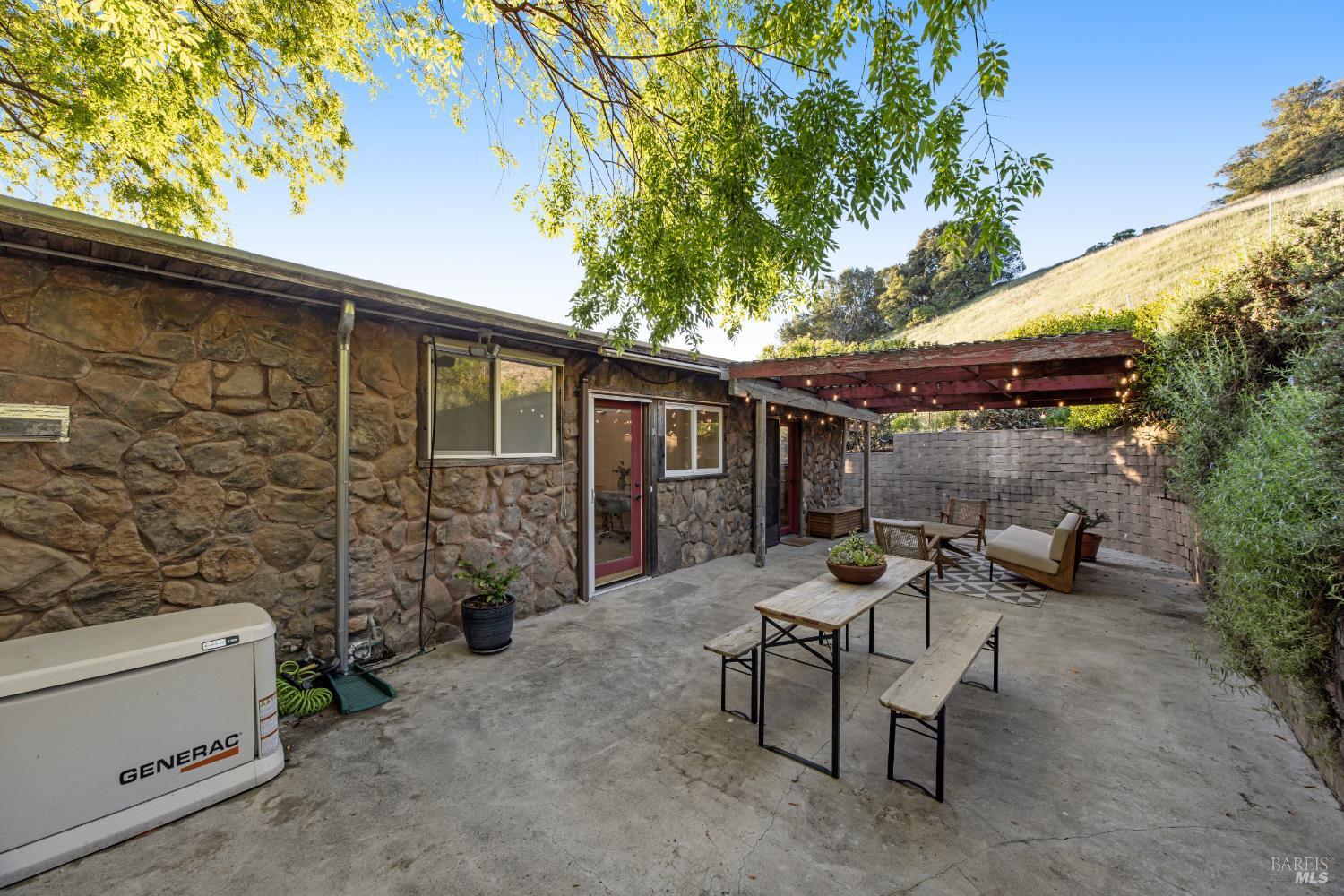 6960 Round Oak Road Penngrove, CA 94951 - Photo 44 of 58 a view of a patio with chairs and tables