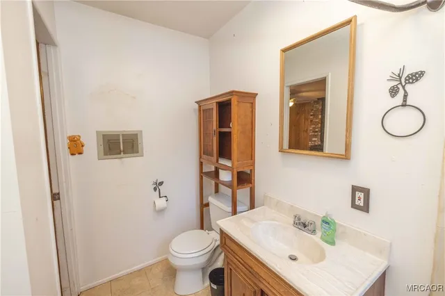 a bedroom with a bed and a lamp