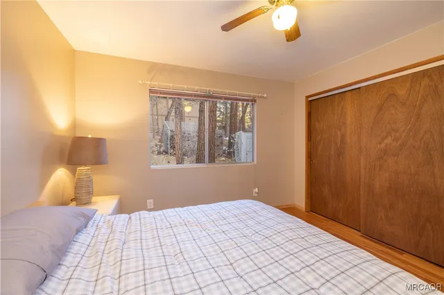 a bedroom with a bed and a lamp