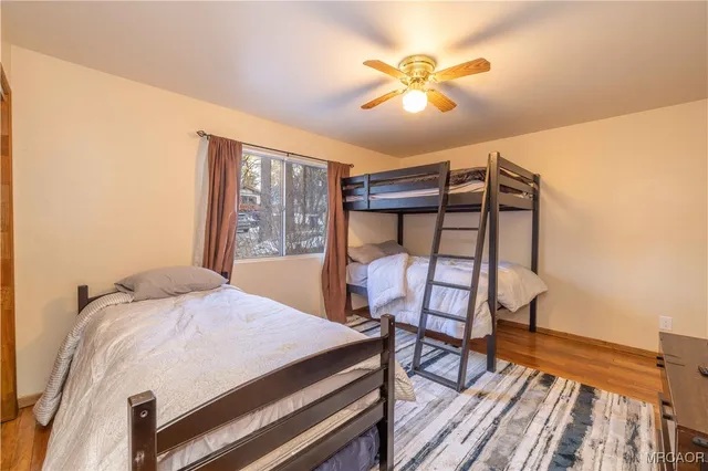 a bed room with a bed and a chandelier