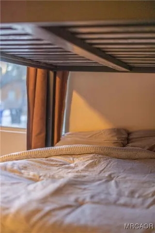 a view of a backyard with furniture and trees