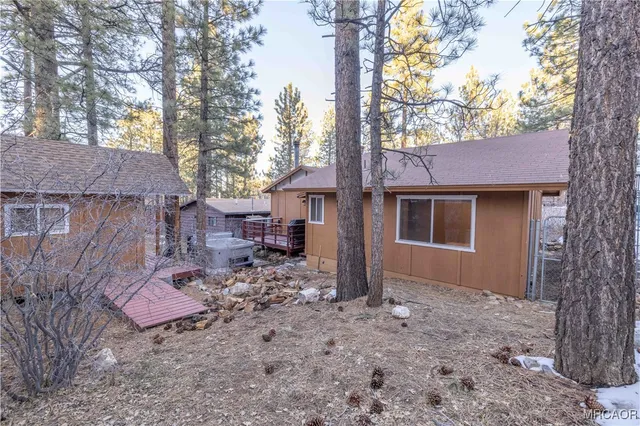 a view of a balcony with chair and wooden floor