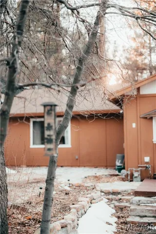 a view of a chairs and table in the patio