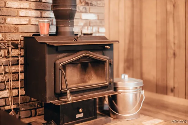 a living room with a stove and a table