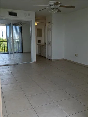 a view of empty room with a fireplace