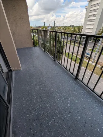 a view of balcony with furniture