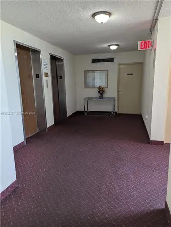 a view of empty room with closet