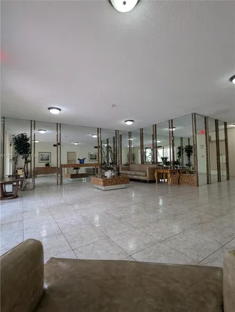 a view of a living room and a garage