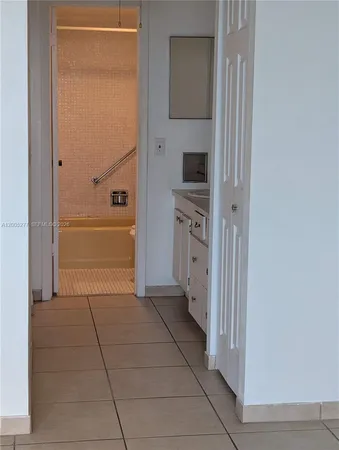 a bathroom with a bathtub and a sink