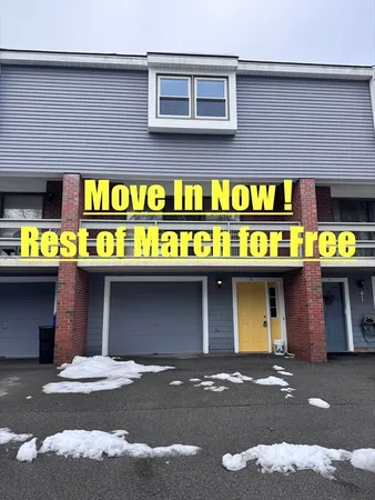 a view of a house with a patio and a yard