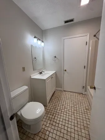 a view of a hallway with a white door