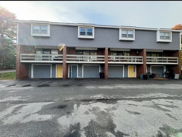 a view of a car park in front of building