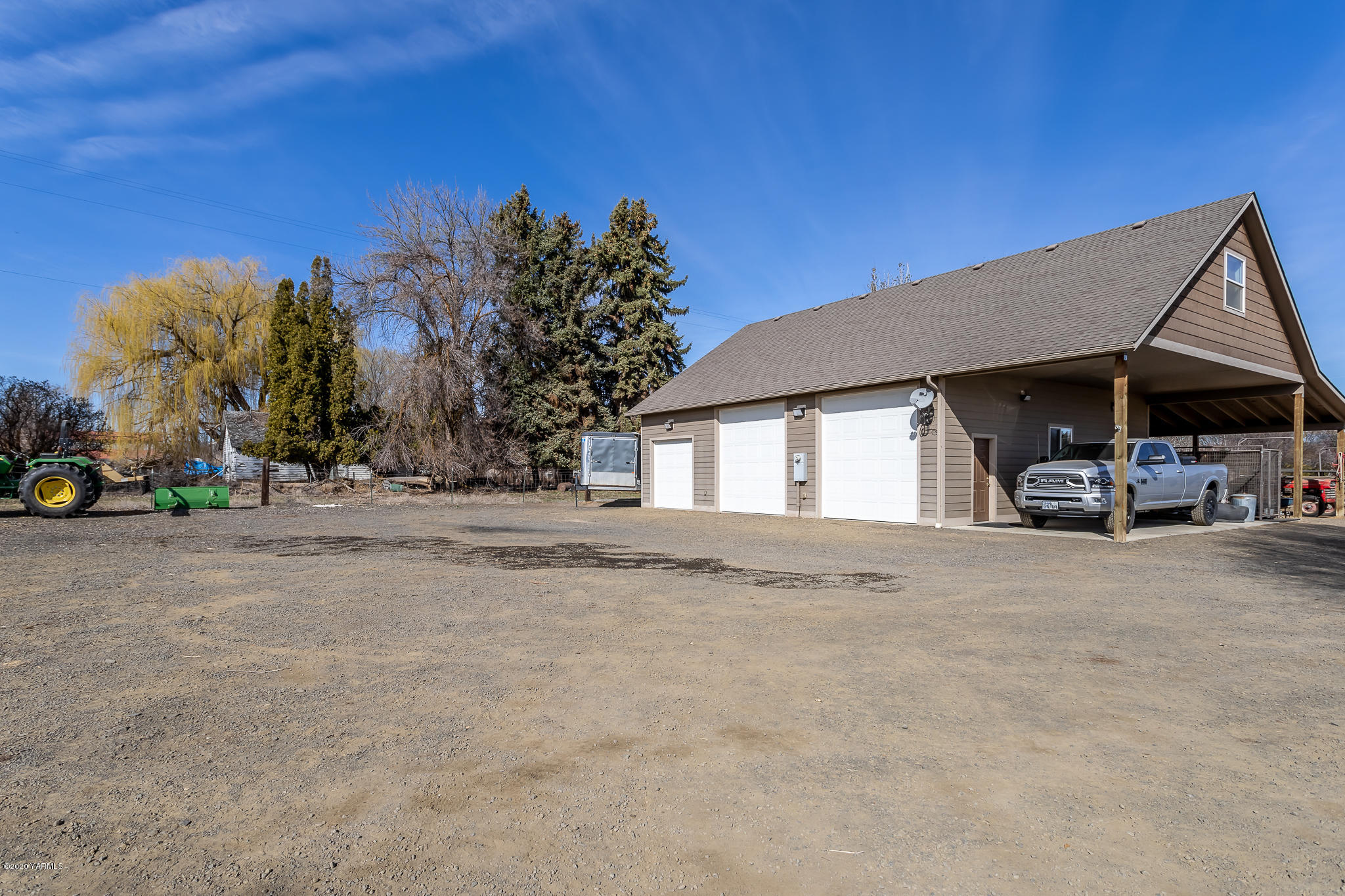 12100 Rutherford Road Yakima, WA 98903 - Photo 11 of 36 a view of a house with cars park next to a road